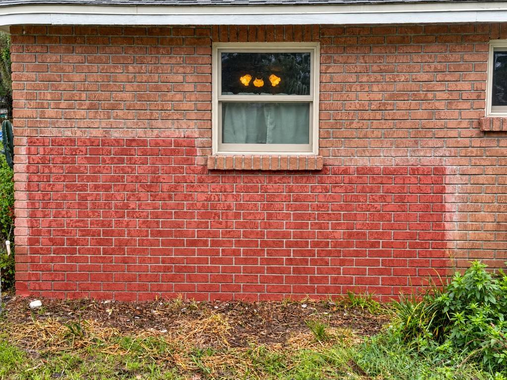 Exterior brick painting and refinishing on a home facade
